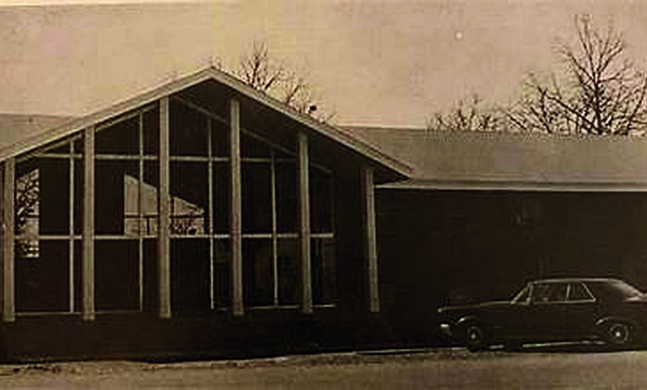 The former Beta house with a steep gabled roof and tall windows