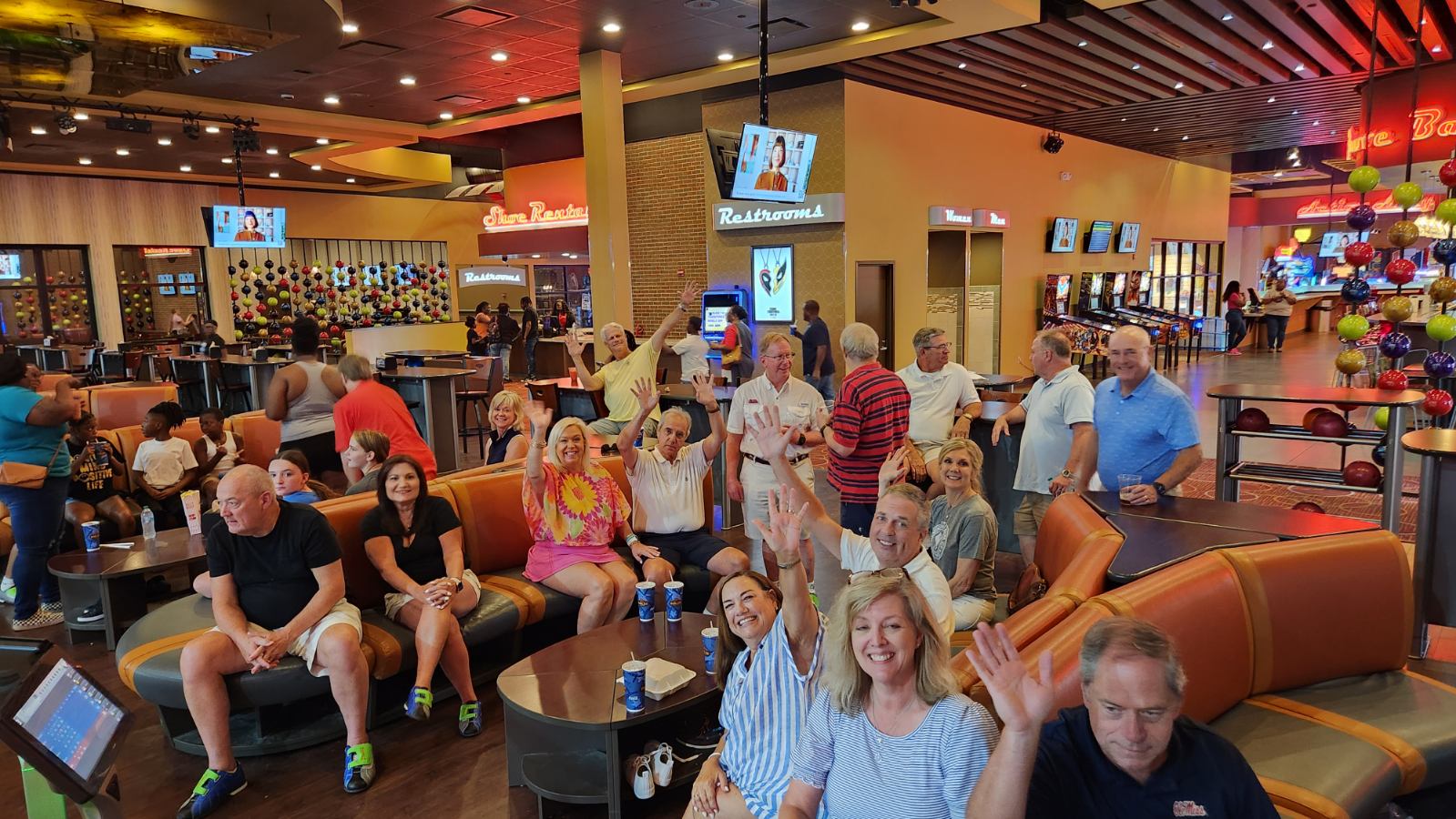 Alumni and guests enjoying a reunion outing at a bowling venue